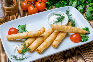 sigara Burek on wooden table Turkish cuisine