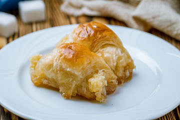 milk baklava on wooden table. Turkish cuisine