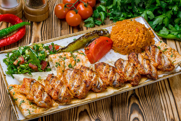chicken wings kebab on wooden table Turkish cuisine