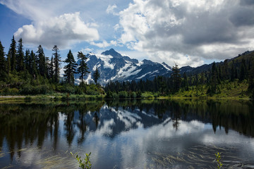 Fototapeta na wymiar View of snow covered mountains from Picture Lake - Mount Baker National Forest Washington