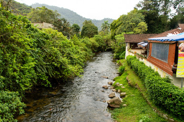 Fototapeta na wymiar small black river in the middle of the city, Maringá, Minas Gerais