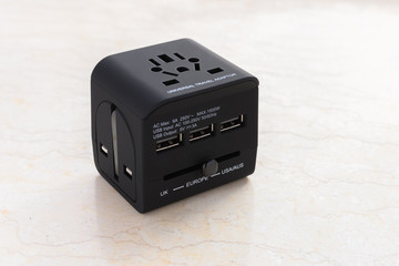 a brand new black universal adapter