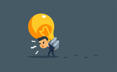 a businessman is carry a giant bulb