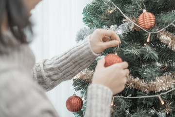 Merry christmas happy couple people decorate the christmas tree for happy holidays in home, christmas concept