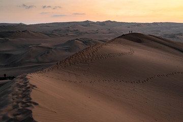 Fototapeta na wymiar Huacachina a world with buggy desert oasis and dunes of Peru