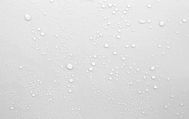 Fotobehang Waterdruppels op een grijze achtergrond © treerasak
