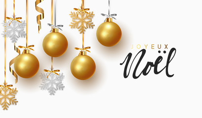 French text Joyeux Noel. Christmas greeting card, design of xmas balls with golden glitter snowflake hanging on the ribbon.