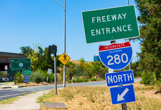 Freeway 280 entrance sign, turned off ramp meter sign, pedestrian crossing sign next to freeway onramp.
