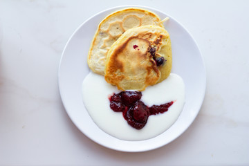 pancakes with ice cream and strawberries