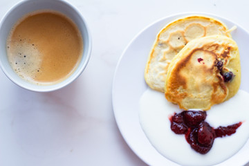 cup of coffee and cake on wooden table