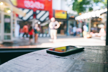 A single mobile phone on wooden table in the shop