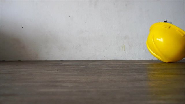 Safety hat falls on the ground