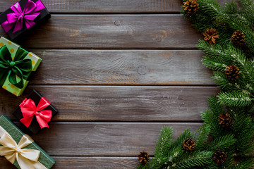 Boxes with presents and fir tree frame for christmas on wooden background top veiw mock-up