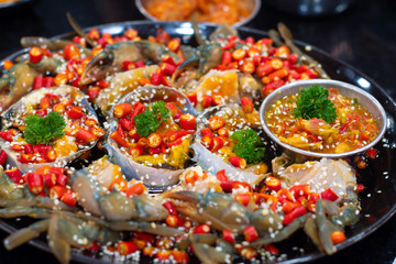Spicy fresh raw blue crab salad with many chili and seafood sauce. popular thai food.