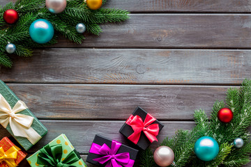 Boxes with presents and fir tree frame for christmas on wooden background top veiw mock-up