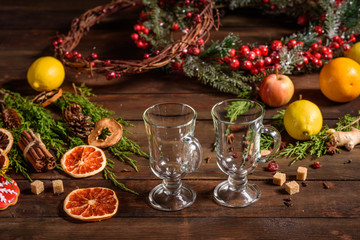 Christmas hot mulled wine with cinnamon cardamom and anise on wooden background