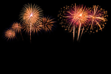 Fototapeta na wymiar The colorful of fireworks showing on dark sky at night time for special celebration day with black background.