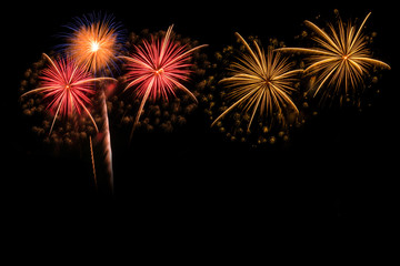 The colorful of fireworks showing on dark sky at night time for special celebration day with black...
