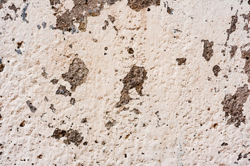 Texture of a concrete wall with cracks and scratches which can be used as a background
