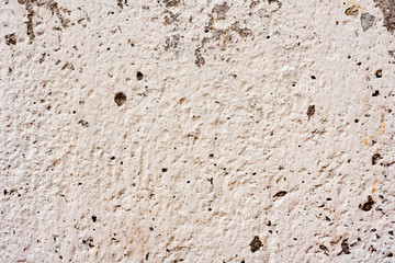 Texture of a concrete wall with cracks and scratches which can be used as a background