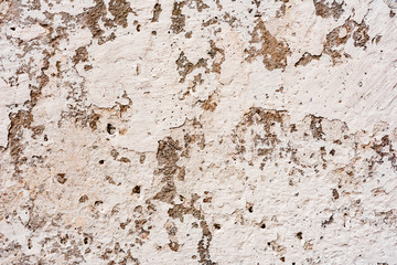 Texture of a concrete wall with cracks and scratches which can be used as a background