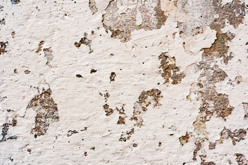 Texture of a concrete wall with cracks and scratches which can be used as a background
