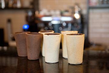Glasses for coffee on the table in the interiors of the bar.