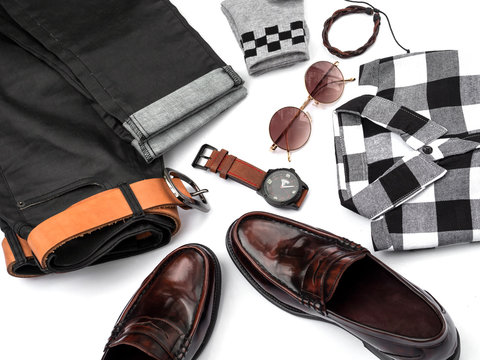 Creative fashion design for men casual clothing set on white background include Loafer shoes, jeans, plaid shirt, watch, sunglasses, sock and belt. top view, Men collection concept.