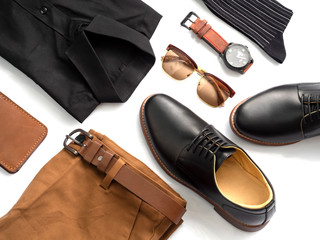 Creative fashion design for men casual clothing set isolated on white background include black shoes, pants, office shirt, watch, sunglasses, sock and belt. top view, Black and brown concept.