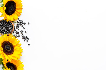 Field flowers design with sunflowers and seeds frame on white background top view space for text