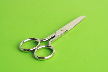 sewing scissors on colorful background