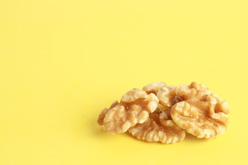 Peeled walnuts in colorful background