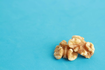 Peeled walnuts in colorful background