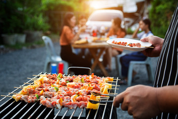 Barbeque Grill Street Food in thailand,Eat outdoors in a happy family. holiday celebration concept