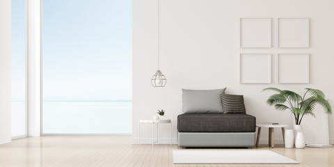 Fototapeta na wymiar View of living room in minimal style with sofa and small side table on wood laminate floor. Perspective of interior design on sea view background. 3D rendering.