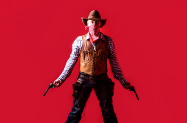 Man wearing cowboy hat, gun. West, guns. Portrait of a cowboy. owboy with weapon on red background. American bandit in mask, western man with hat. Portrait of farmer or cowboy in hat - obrazy, fototapety, plakaty