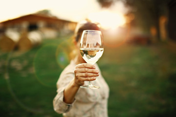 Happy woman white wine in the hand, travel holidays, new places