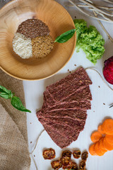 Ukrainian Crispbread  with beetroot and tomato. Healthy diet food. Bread cakes on a white background in the ingredient seasoning.
