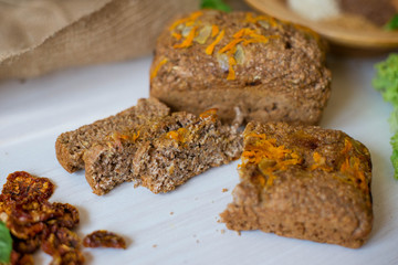 Dietary bread without yeast from whole grain flour. Healthy food, bread with vegetables and bran.
