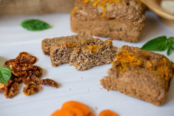 Dietary bread without yeast from whole grain flour. Healthy food, bread with vegetables and bran.
