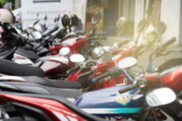 Obraz premium Motorcycles parking city street front the building
