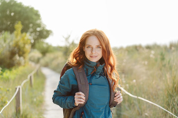 Intense young woman enjoying an autumn hike