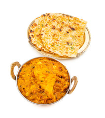 Indian Vegetarian Cuisine Special Sweet And Spicy Paneer Pasanda or Stuffed Paneer Curry, Delicacy Consisting of Stuffed Paneer with Rich Creamy Gravy Served With Garlic Naan on White Background