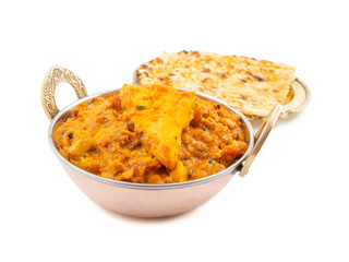 Indian Vegetarian Cuisine Special Sweet And Spicy Paneer Pasanda or Stuffed Paneer Curry, Delicacy Consisting of Stuffed Paneer with Rich Creamy Gravy Served With Garlic Naan on White Background