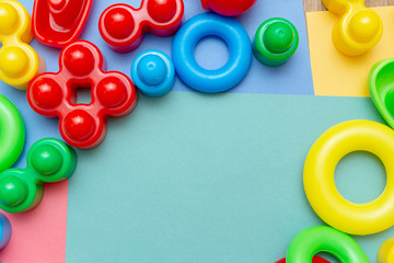 Colorful child kid’s education toys pattern background copy space on the bright background. Childhood infancy children babies concept