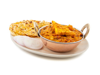 Indian Vegetarian Cuisine Special Sweet And Spicy Paneer Pasanda or Stuffed Paneer Curry, Delicacy Consisting of Stuffed Paneer with Rich Creamy Gravy Served With Garlic Naan on White Background