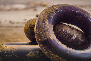 Black life ring for rent on the beach, Life ring on the sand at beach in Thailand.