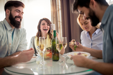 Friends having lunch together at home