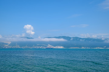 Fototapeta na wymiar Seascape of the cement bay, Sea and mountains near