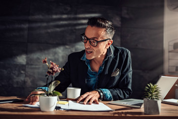 Businessman doing paperwork in his office